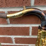 house fire, damaged saxophone neck, charred and burned lacquer, cracked lacquer,