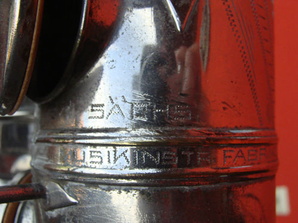 engraving on the bell to bow connecting ring 1